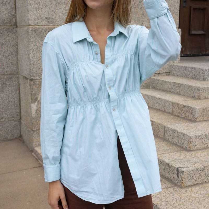 woman in teal button-up