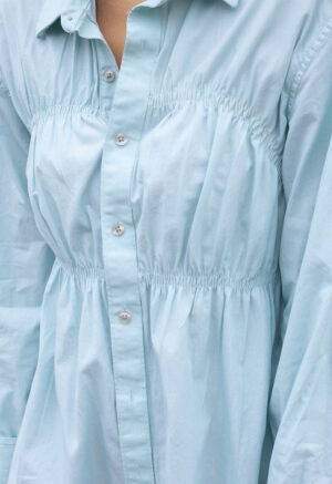 woman in teal button-up