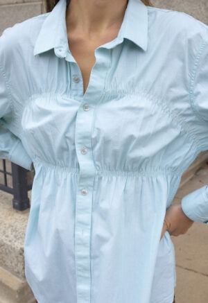 woman in teal button-up