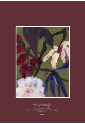 Dark maroon cover of book with dark floral painting