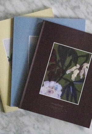 three books on a coffee table