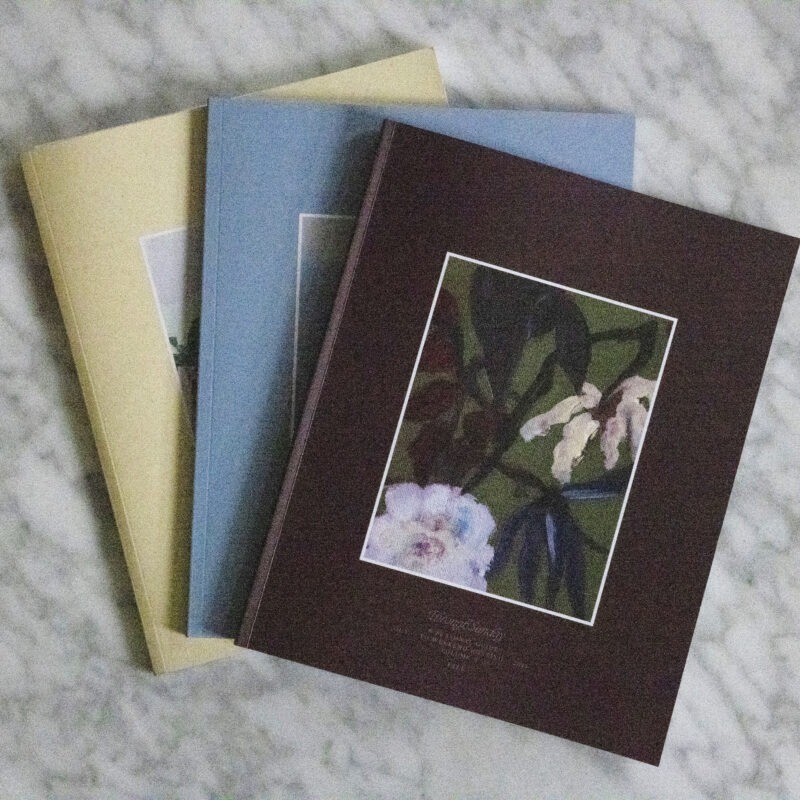 three books on a coffee table