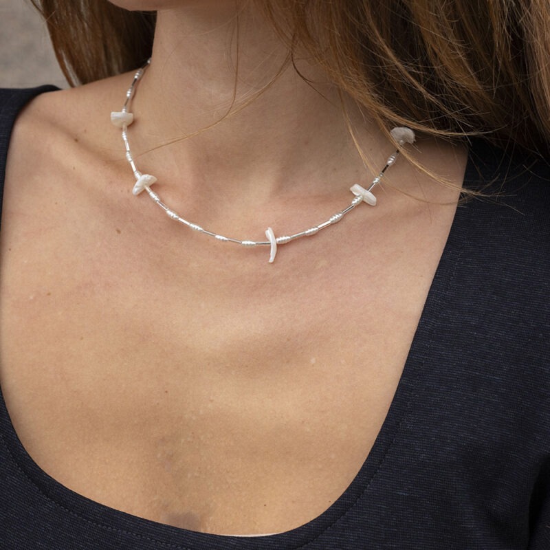 woman wearing necklace